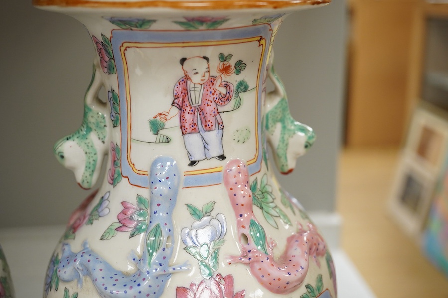 A pair of Chinese famille rose vases, 30cm high